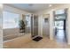 Bright bathroom featuring large soaking tub, glass enclosed shower, and views of bedroom at 549 W Sweet Shrub Ave, Queen Creek, AZ 85140