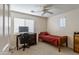 Bright bedroom featuring a comfortable twin bed, desk, and dark wood desk at 549 W Sweet Shrub Ave, Queen Creek, AZ 85140