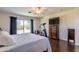 Large bedroom with ceiling fan and access to private balcony with neighborhood views at 549 W Sweet Shrub Ave, Queen Creek, AZ 85140