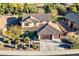 Two-story home with a tile roof, three-car garage, and well-manicured landscaping at 549 W Sweet Shrub Ave, Queen Creek, AZ 85140