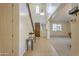 Grand foyer with tile flooring, high ceilings, staircase, and view into the living spaces at 549 W Sweet Shrub Ave, Queen Creek, AZ 85140