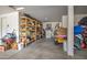 This garage features ample storage space with shelving and room for storage at 549 W Sweet Shrub Ave, Queen Creek, AZ 85140
