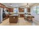 Well-equipped kitchen featuring granite countertops, stainless steel appliances, and island with seating at 549 W Sweet Shrub Ave, Queen Creek, AZ 85140