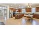 Modern kitchen with stainless steel appliances, granite countertops, and abundant cabinet space at 549 W Sweet Shrub Ave, Queen Creek, AZ 85140