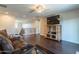 Open living area with wood floors, staircase view, and comfortable seating at 549 W Sweet Shrub Ave, Queen Creek, AZ 85140