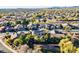 Aerial view of a neighborhood showcasing the mix of architectural styles and lush greenery at 549 W Sweet Shrub Ave, Queen Creek, AZ 85140