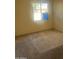 Carpeted bedroom with a window and neutral paint at 5534 W Calavar Rd, Glendale, AZ 85306