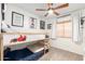 This charming ' bedroom features a race car theme and a custom-built bunk bed at 6526 W West Wind Dr, Glendale, AZ 85310