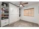 This versatile bedroom boasts a custom Murphy bed for flexible space usage and a sleek, modern design at 6526 W West Wind Dr, Glendale, AZ 85310