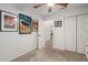This cozy bedroom offers ample storage with a double-door closet and a stylish design with racecar-themed artwork at 6526 W West Wind Dr, Glendale, AZ 85310