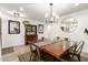 Bright dining room with a large table, stylish lighting, and modern decor at 6526 W West Wind Dr, Glendale, AZ 85310