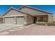 Charming single-story home featuring a three-car garage and well-maintained desert landscaping at 6526 W West Wind Dr, Glendale, AZ 85310