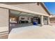 This spacious three-car garage is well-equipped with epoxy flooring and workshop space for automotive enthusiasts at 6526 W West Wind Dr, Glendale, AZ 85310