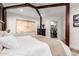 This bedroom is light and airy with a large window, closet, and plenty of space for rest and relaxation at 6526 W West Wind Dr, Glendale, AZ 85310