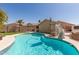 Inviting backyard pool featuring a slide, patio and well-kept landscaping at 6526 W West Wind Dr, Glendale, AZ 85310