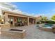 Backyard pool, hot tub and fire pit create an inviting atmosphere for relaxing and entertaining outdoors at 6751 S Callaway Dr, Chandler, AZ 85249