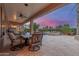 Covered patio with outdoor seating, a pool, a spa, and lush landscaping at 6751 S Callaway Dr, Chandler, AZ 85249