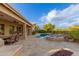 Backyard showcasing the pool, spa, lush landscaping and outdoor kitchen area at 6751 S Callaway Dr, Chandler, AZ 85249