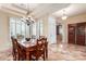 Elegant dining room with a chandelier, large windows, and seating for six at 6751 S Callaway Dr, Chandler, AZ 85249
