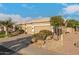 Single-story home with a large two-car garage, lush green grass, and desert landscaping at 6751 S Callaway Dr, Chandler, AZ 85249