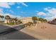 Street view of a single-story home with a two-car garage and desert landscaping at 6751 S Callaway Dr, Chandler, AZ 85249