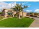 Charming single-story home with a well-manicured lawn and a mature palm tree at 6751 S Callaway Dr, Chandler, AZ 85249