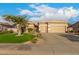 Charming home showcasing a lush front yard with a beautiful palm tree and manicured landscaping at 6751 S Callaway Dr, Chandler, AZ 85249
