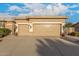 Large two-car garage with beautiful desert landscaping and an address number on the house at 6751 S Callaway Dr, Chandler, AZ 85249