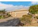 Single-story home with a large two-car garage and desert landscaping at 6751 S Callaway Dr, Chandler, AZ 85249