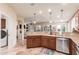 Spacious kitchen featuring granite countertops, stainless steel appliances, and a view into the living area at 6751 S Callaway Dr, Chandler, AZ 85249