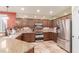 Modern kitchen with stainless steel appliances, granite countertops, and ample cabinet space at 6751 S Callaway Dr, Chandler, AZ 85249
