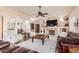 Cozy living room with a fireplace, built-in shelving, and comfortable seating at 6751 S Callaway Dr, Chandler, AZ 85249