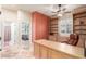 Home office with custom built-ins, desk space, and a view to the bedroom, and a bathroom at 6751 S Callaway Dr, Chandler, AZ 85249