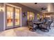 Inviting covered patio with comfortable seating and view into the home's interior at 6751 S Callaway Dr, Chandler, AZ 85249