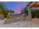 Outdoor kitchen featuring stainless steel grill, stone fire pit and desert landscaping at 6751 S Callaway Dr, Chandler, AZ 85249