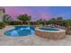 Backyard featuring pool, spa and desert landscaping at dusk at 6751 S Callaway Dr, Chandler, AZ 85249