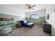 Cozy bedroom featuring a dark metal bed frame, sage accent wall and playful books at 6929 E Trailridge Cir, Mesa, AZ 85207