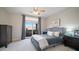 Comfortable bedroom with sliding glass doors to balcony, and neutral décor at 6929 E Trailridge Cir, Mesa, AZ 85207
