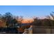 Breathtaking city view from the balcony, showcasing the tranquil sunset and lush surroundings at 6929 E Trailridge Cir, Mesa, AZ 85207