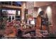 Grand clubhouse lobby with stone fireplace, floor-to-ceiling windows, and elegant furnishings at 6929 E Trailridge Cir, Mesa, AZ 85207