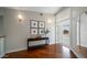 Elegant hallway featuring a decorative console table and access to multiple rooms at 6929 E Trailridge Cir, Mesa, AZ 85207