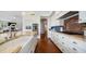 Modern kitchen boasting granite countertops, an island, and plenty of storage space at 6929 E Trailridge Cir, Mesa, AZ 85207