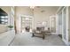 Spacious living room with a view into dining area, complemented by high ceilings and ample natural light at 6929 E Trailridge Cir, Mesa, AZ 85207