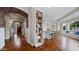 Open-concept living space with hardwood floors and custom built-ins at 6929 E Trailridge Cir, Mesa, AZ 85207