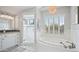 Bright bathroom with a soaking tub, walk-in shower, and stylish fixtures at 6929 E Trailridge Cir, Mesa, AZ 85207