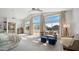 Open main bedroom featuring vaulted ceilings, a balcony, and a cozy seating area at 6929 E Trailridge Cir, Mesa, AZ 85207