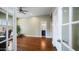 Inviting office with hardwood floors, ceiling fan, and view of the bathroom at 6929 E Trailridge Cir, Mesa, AZ 85207