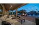 Inviting outdoor living area featuring a comfortable seating area, firepit, and views of the pool at 6929 E Trailridge Cir, Mesa, AZ 85207