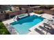 Aerial view of pool showcasing the diving board, slide, hot tub, and lounge chairs for a luxury outdoor space at 6929 E Trailridge Cir, Mesa, AZ 85207