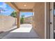 Covered back patio with block wall and paver stones at 7115 E Olla Ave, Mesa, AZ 85212